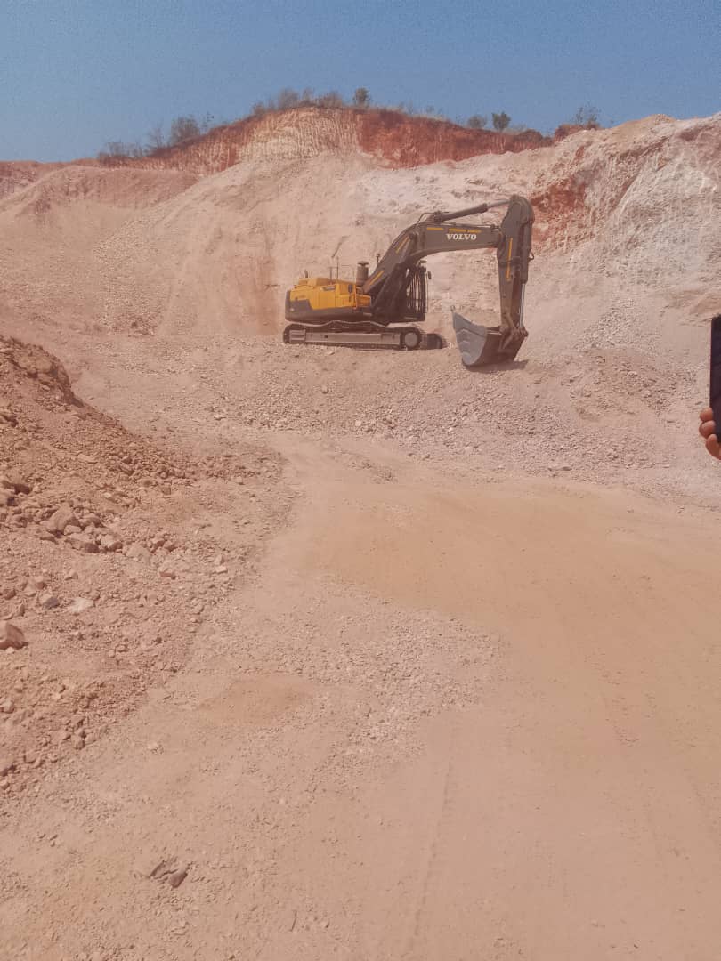 Volvo excavator at quarry mining site